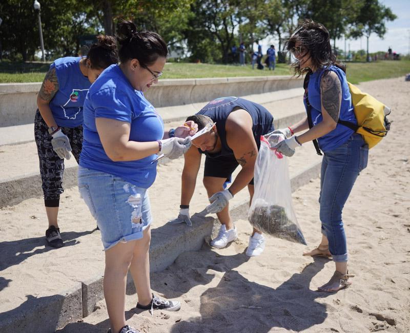 Photo of students helping clean up nearby beach